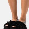Ugg Disco Cross Slide - Pantoffels - Black -Ugg 42ed0fa8931e44ce8edf31223c44e6b1
